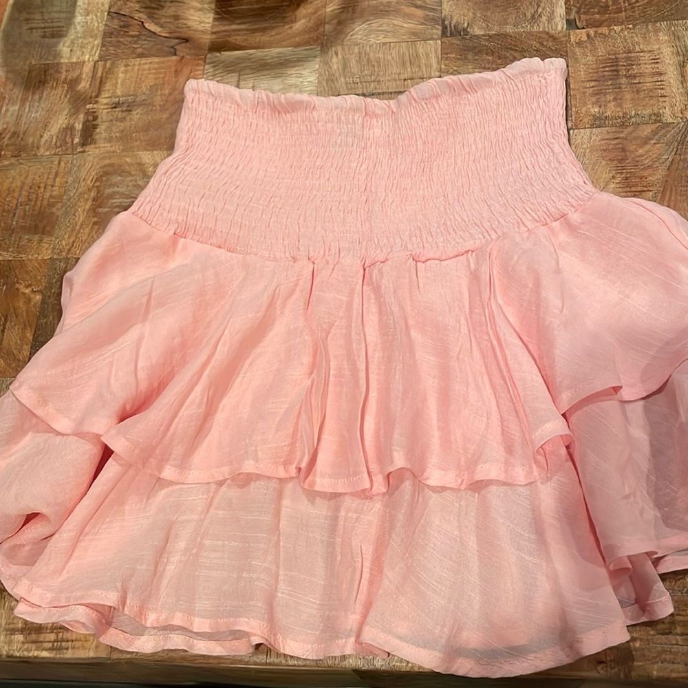 Light pink top with ruffle layers! Size small.